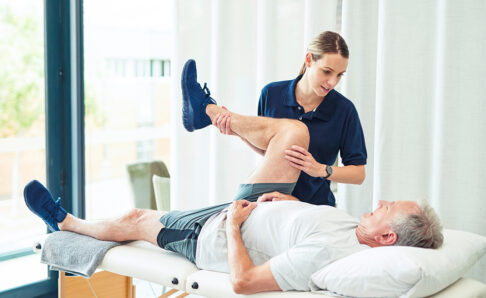 Physiotherapy doctor, senior patient and leg surgery, physical therapy and orthopedic healing. Physiotherapist, chiropractor and nurse help elderly injury, osteoporosis and arthritis rehabilitation